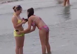 Damsels in bathing suit at beach